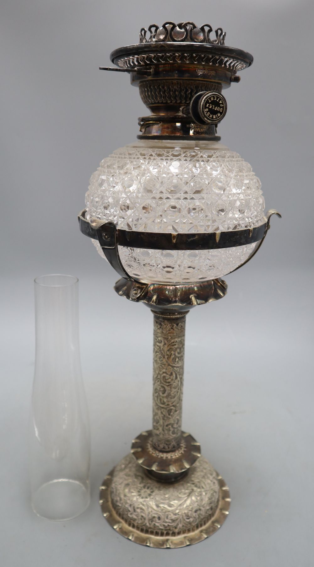 A 19th century Hinks & Son silver plate and cut glass oil lamp, overall height 68cm incl. chimney